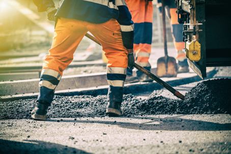 Group of workers doing road construction