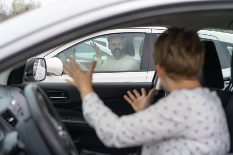 Two individuals appear to be arguing in their car